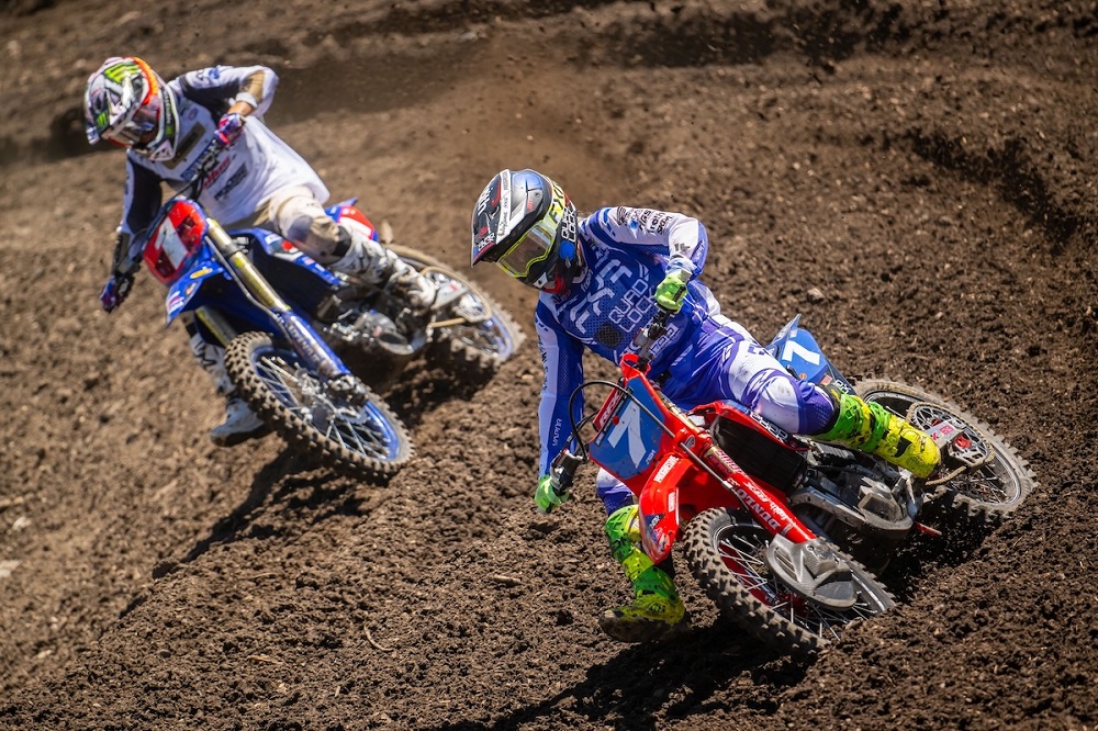 Two motocross riders on a dirt track